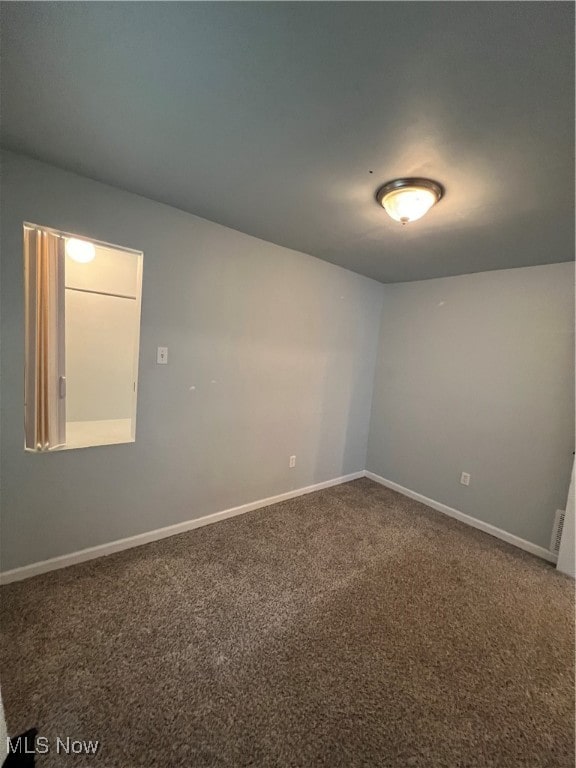 spare room with carpet flooring