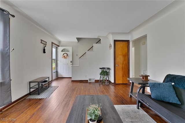 living room with dark hardwood / wood-style flooring