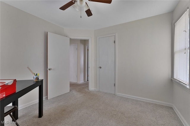 interior space with a healthy amount of sunlight and ceiling fan