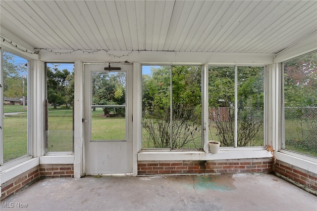 unfurnished sunroom featuring a healthy amount of sunlight