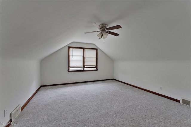 bonus room with carpet, vaulted ceiling, and ceiling fan