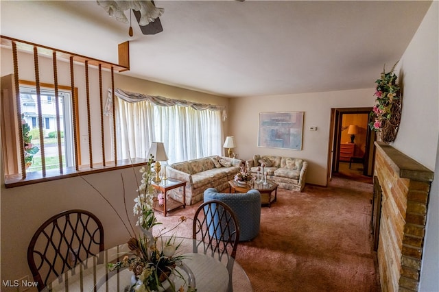 carpeted living room featuring ceiling fan