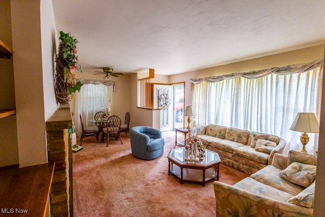 living room featuring ceiling fan and carpet flooring