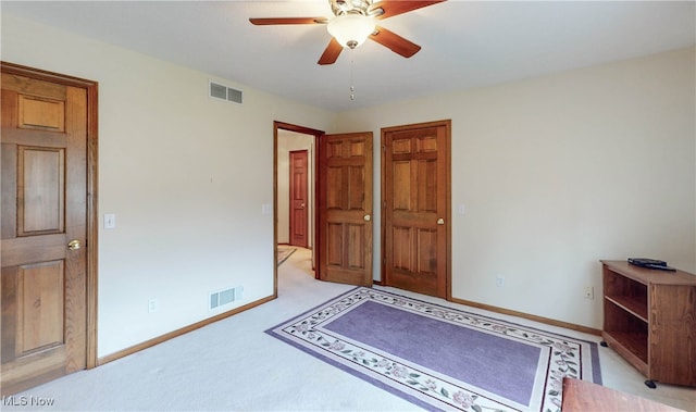 carpeted bedroom with ceiling fan