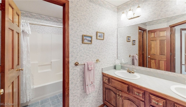 bathroom with shower / bath combo with shower curtain, tile patterned floors, and vanity