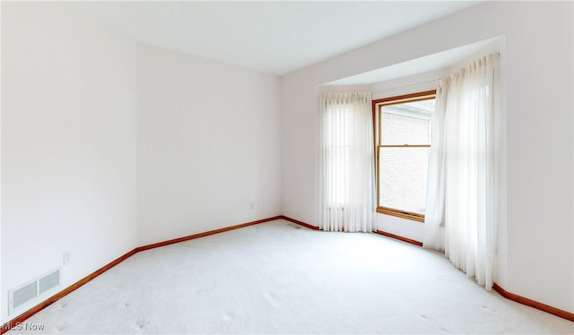 empty room with light colored carpet