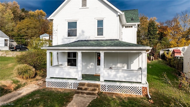 view of front of home with a front lawn and covered porch