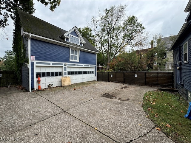 view of side of property featuring a garage