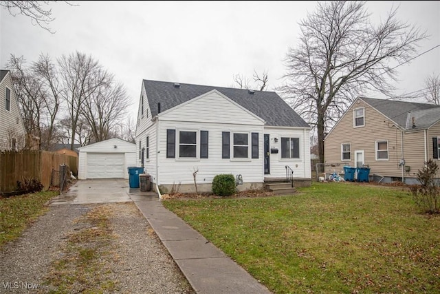 bungalow-style house featuring a garage, central AC, an outdoor structure, and a front yard