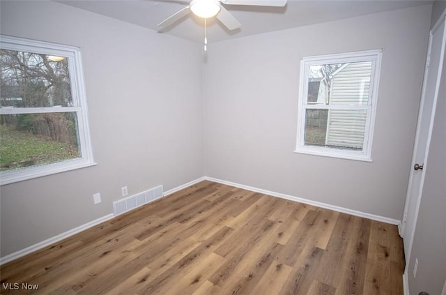 unfurnished room featuring wood-type flooring and ceiling fan