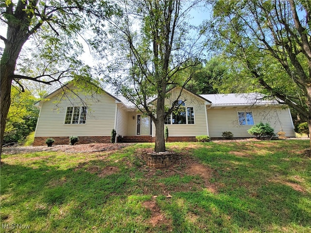 single story home featuring a front yard