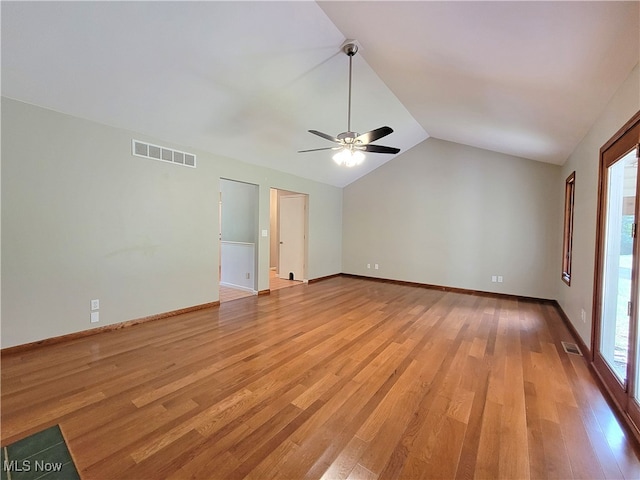 unfurnished room featuring ceiling fan, light hardwood / wood-style flooring, and lofted ceiling