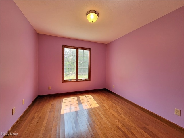 unfurnished room featuring light wood-type flooring