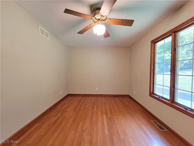 unfurnished room featuring ceiling fan and light hardwood / wood-style floors