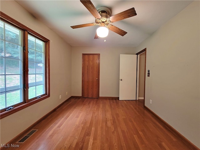 unfurnished bedroom with light hardwood / wood-style flooring and ceiling fan