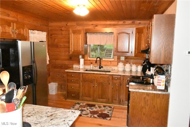 kitchen featuring wood ceiling, sink, stainless steel fridge with ice dispenser, and light hardwood / wood-style flooring