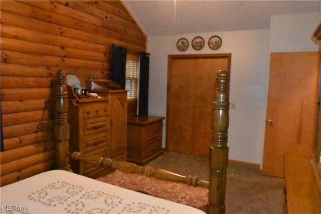 bedroom with lofted ceiling and log walls