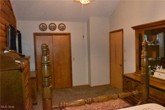 carpeted bedroom featuring vaulted ceiling