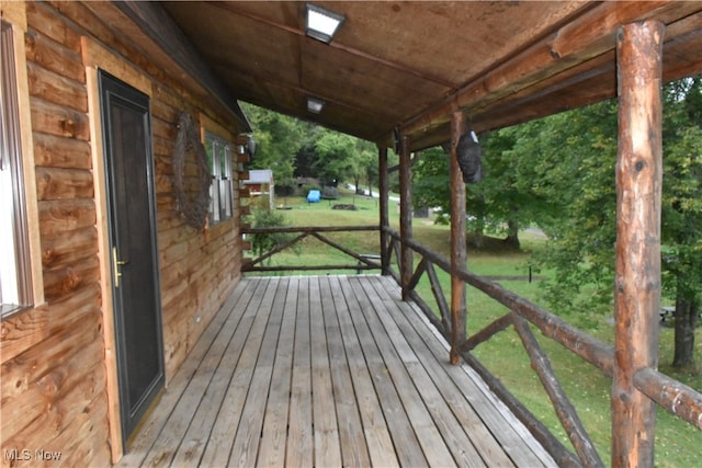 deck featuring a lawn