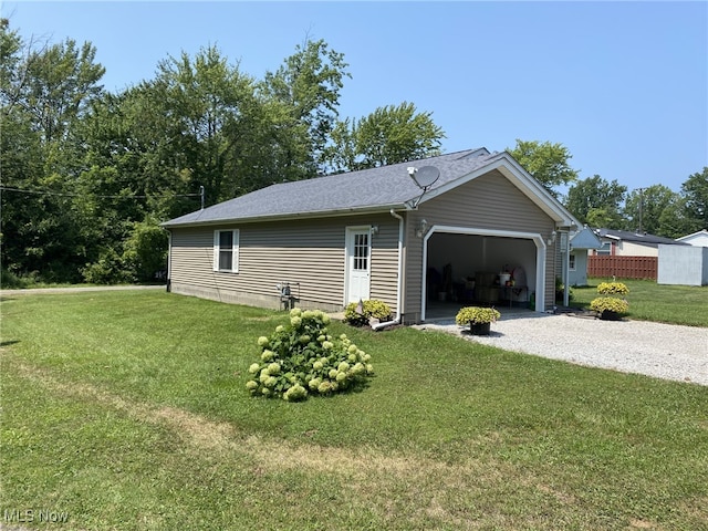4865 Kathryn Dr, Geneva, OH 44041 - garage with a lawn