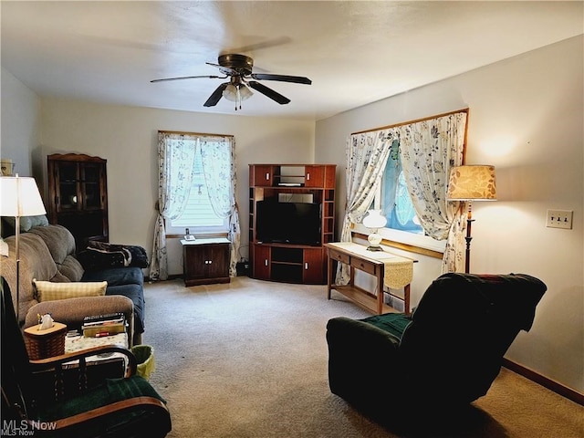 living room featuring carpet floors and ceiling fan