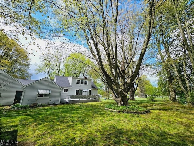 view of yard with a deck