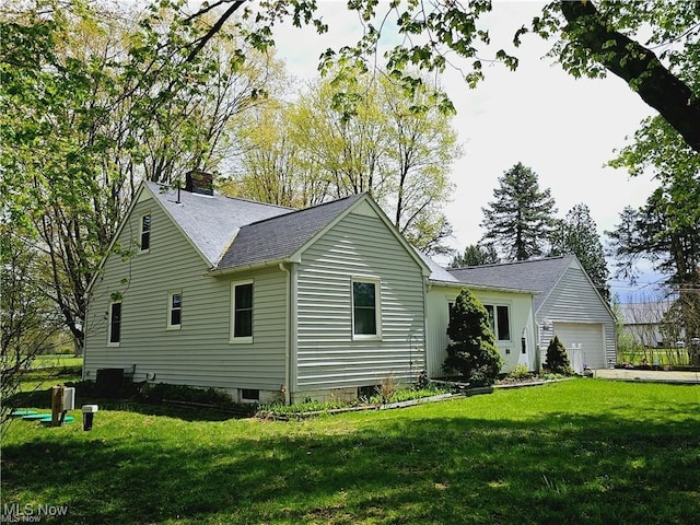 rear view of property with a yard