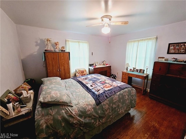 bedroom featuring ceiling fan and dark hardwood / wood-style flooring