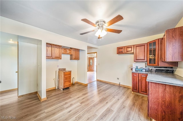 kitchen featuring ceiling fan and light hardwood / wood-style floors