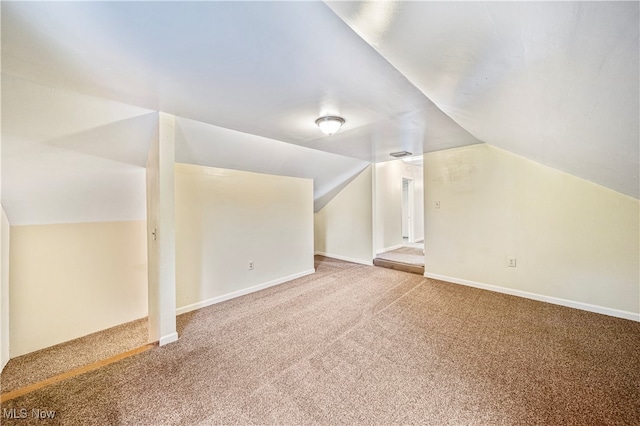 bonus room with carpet and lofted ceiling