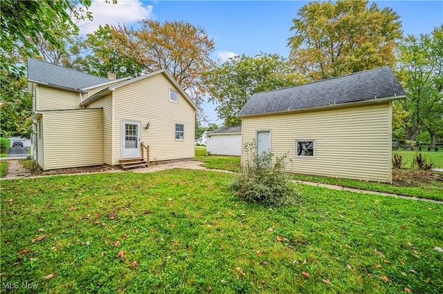 rear view of house with a lawn