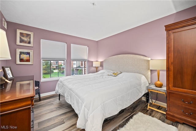 bedroom with light hardwood / wood-style floors