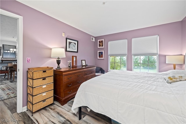 bedroom featuring light hardwood / wood-style flooring