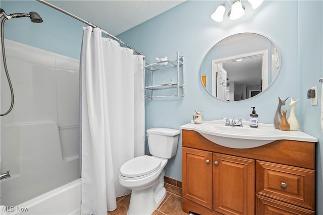 full bathroom with vanity, a textured ceiling, shower / bath combo, toilet, and tile patterned floors