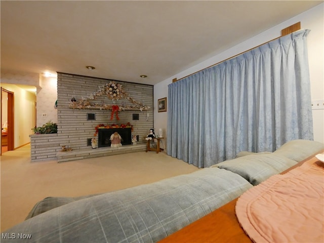 carpeted living room featuring a fireplace