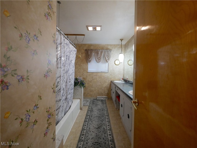 bathroom with vanity, shower / tub combo, and tile patterned flooring