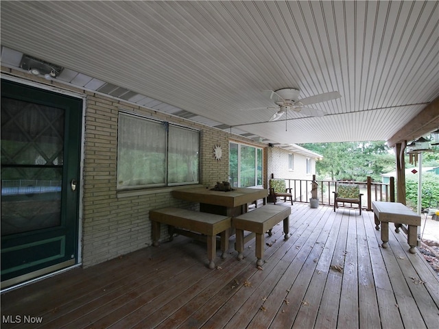 wooden deck featuring ceiling fan