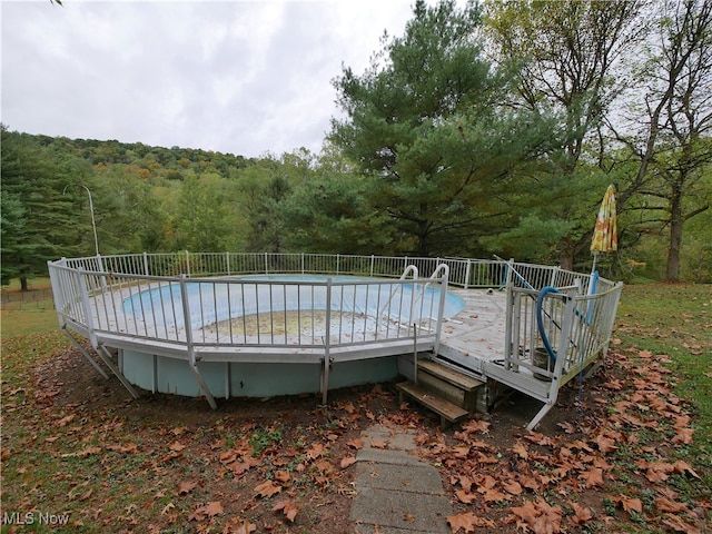 view of pool featuring a wooden deck