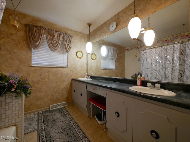 bathroom with vanity and curtained shower