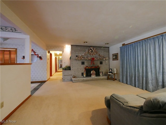 carpeted living room featuring a fireplace