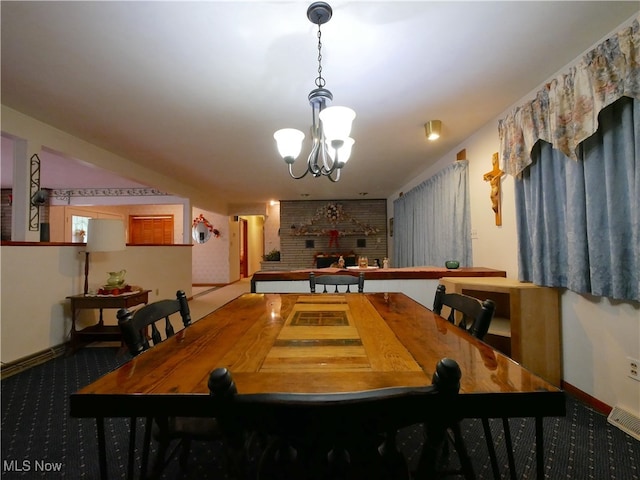 carpeted dining room with a notable chandelier