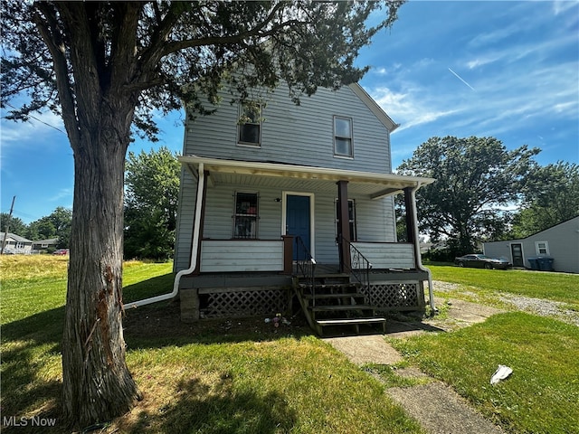 view of front facade with a front yard and a porch