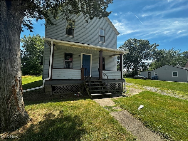 view of front of home with a front yard and a porch