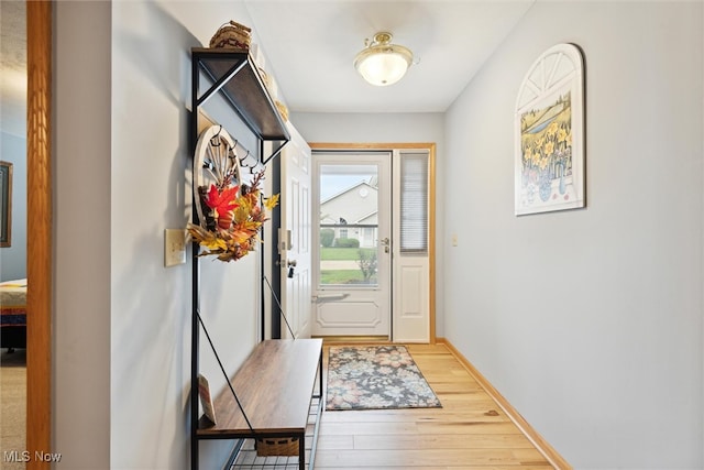 doorway to outside with light hardwood / wood-style floors