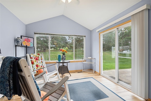 interior space with ceiling fan, vaulted ceiling, and a wealth of natural light