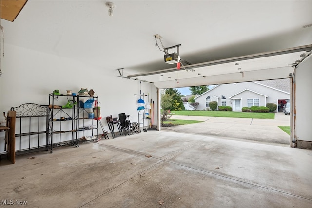 garage featuring a garage door opener, a yard, and a carport