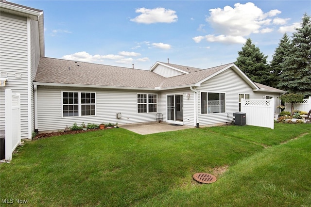 back of house featuring a patio, central air condition unit, and a yard