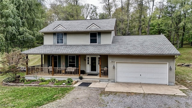 view of front of home with covered porch and a garage