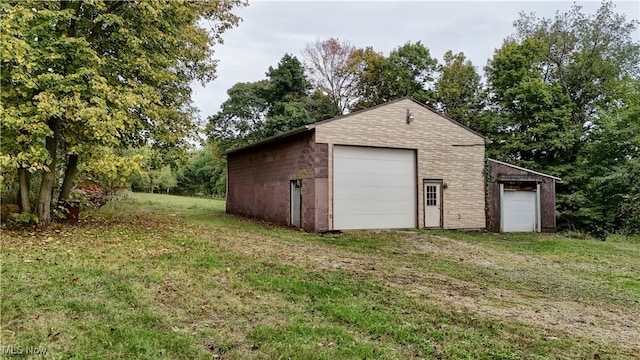 garage with a lawn