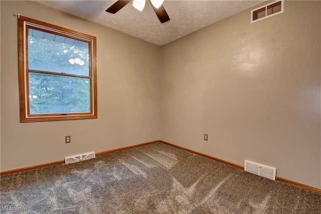 empty room with carpet, a textured ceiling, and ceiling fan